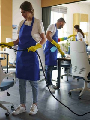 professional-cleaning-service-person-using-vacuum-cleaner-office-min
